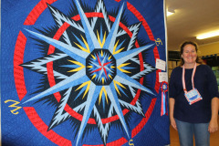 jill-with-her-mariners-compass-quilt-that-won-best-first-time-entrant_44376703864_o