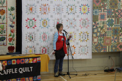 Donna-announcing-the-winner-of-the-raffle-quilt