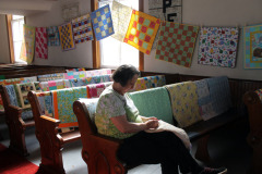 sheila-finishes-sewing-a-binding_39985492715_o