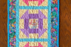 elizabeth-t-easter-table-runner-machine-pieced-machine-quilted-by-paul-macdonald_51228222307_o