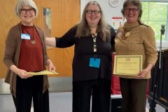 Our-President-presenting-Honorary-Life-Memberships-to-two-of-our-Founding-Members-Valerie-and-Michelle-scaled