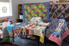 just-a-few-of-the-cuddle-quilts-which-were-donated_51007197510_o