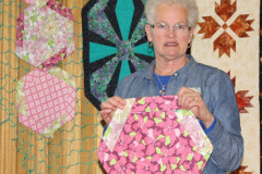bev-shows-her-hexie-placemats-a-workshop-she-is-teaching-at-atlantic-fabrics_13937819137_o