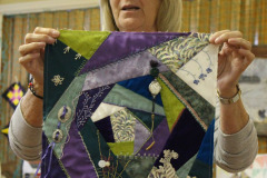 sharon-with-her-crazy-quilt-block-using-her-aunts-treasures_42171999071_o