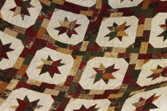 detail-of-isabels-holly-stars-quilt_47882785211_o