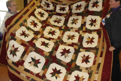 isabels-holly-stars-quilt-quilted-by-lynn-jones_47882785391_o