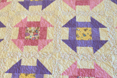 easter-lap-quilt-churn-dash-block-elizabeth-t-machine-pieced-machine-quilted-by-paul-macdonald_50327181912_o
